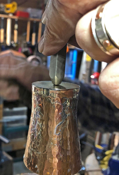 copper and silver shot glass maker's mark