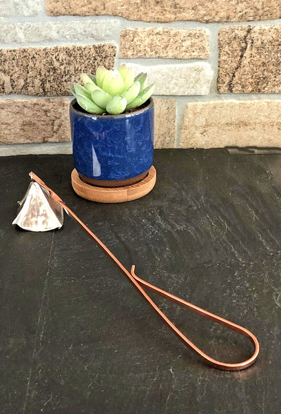 silver candle snuffer with copper handle